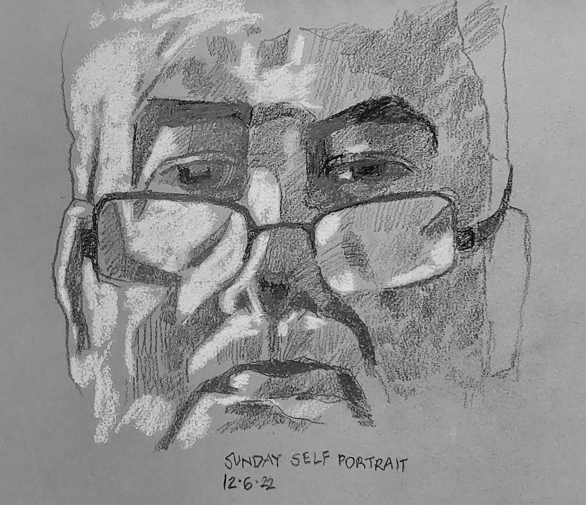 Sunday self-portrait. Blackwing pencil, white conté crayon, on A4 grey-toned Stillman and Birn sketchbook. Window on the left.