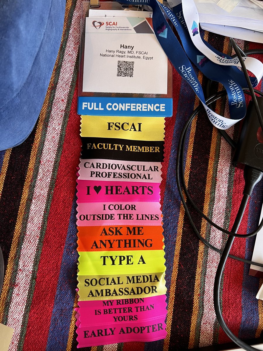 Hragy's tweet image. Believe it or not,just emptying my luggage after #SCAI2022, I landed from Atlanta straight to the vet for Eshta’s surgery,been jet lagging,but sleep deprived cause of the restless injured pup,days filled with very complex PCI’s cause of fragile patients..my badge made me smile!