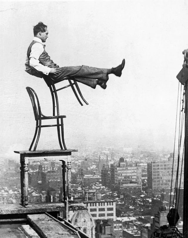 historydefined's tweet photo. "Human Fly" John "Jammie" Reynolds balancing on a New York rooftop, between 1915 and 1920. https://t.co/UcA3qsrSIA