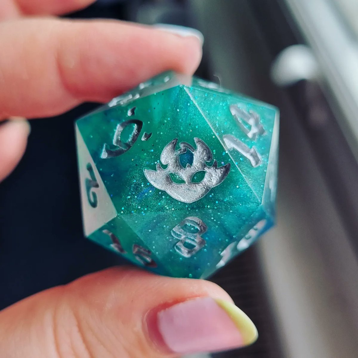 TheDiceling's tweet photo. Made a custom made chonky dice for a customer at MCM! They asked for green/blue sea vibes with a bit of shimmer and silver numbers so I'm sending this off tomorrow 🥰 https://t.co/P6IVumEBQo