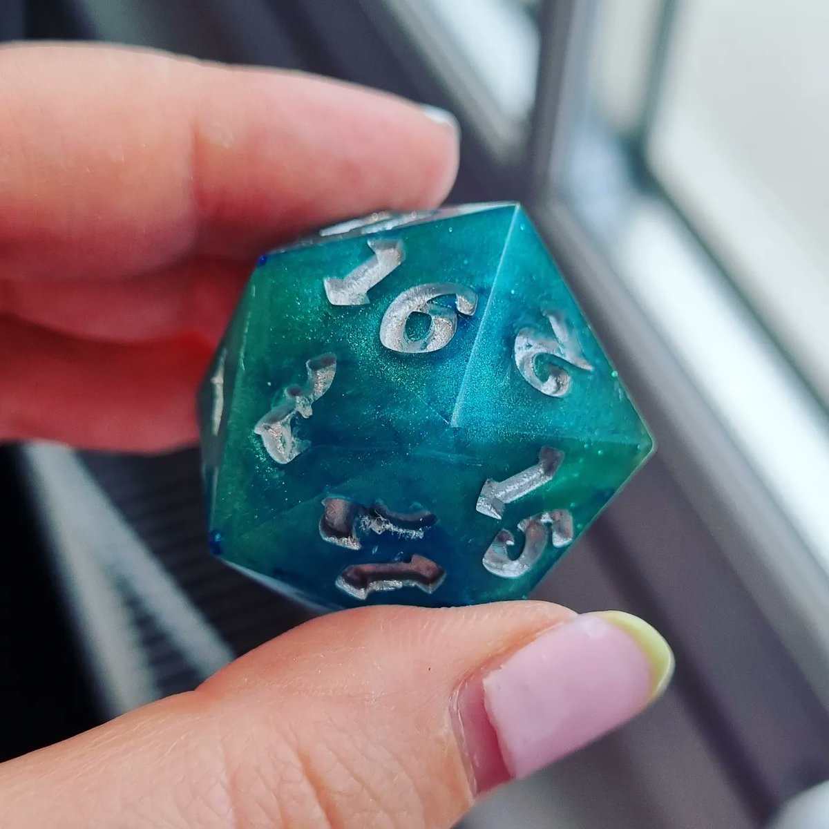 TheDiceling's tweet photo. Made a custom made chonky dice for a customer at MCM! They asked for green/blue sea vibes with a bit of shimmer and silver numbers so I'm sending this off tomorrow 🥰 https://t.co/P6IVumEBQo