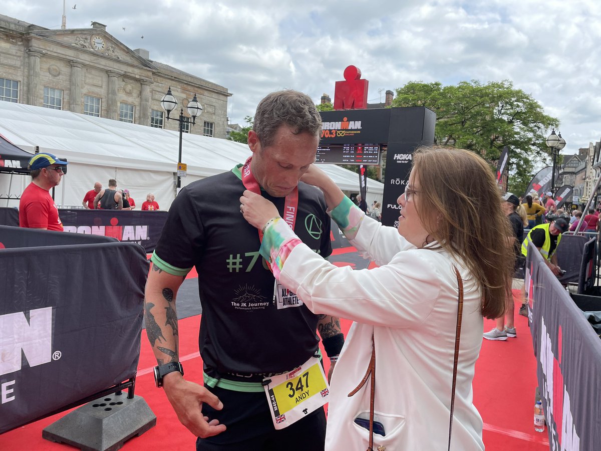 StaffordshireCC's tweet photo. And here he is - Andy Stone - across the line on his record challenge for 70 x 70 triathlons in 7 days, and supporting local and national charities .  Unbelievable he is still standing .  5 more to go. He gets his medal from Cllr Victoria Wilson @Victoria261272 https://t.co/lYlxjRIhXi