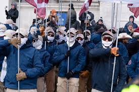 Patriot Front. Clearly feds. Way too clean. Like those boots have never stepped in mud or dirt. Brand new clean masks, glasses and hats. The Feds could search for mass purchases of these clothing types and find the individual members, if they intended to catch them.