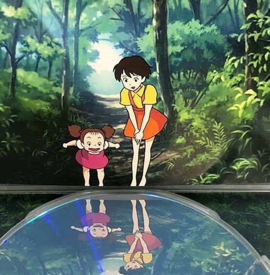 Studio Ghibli designed this dvd case it looks like the characters are checking their reflection in the water it's beautiful