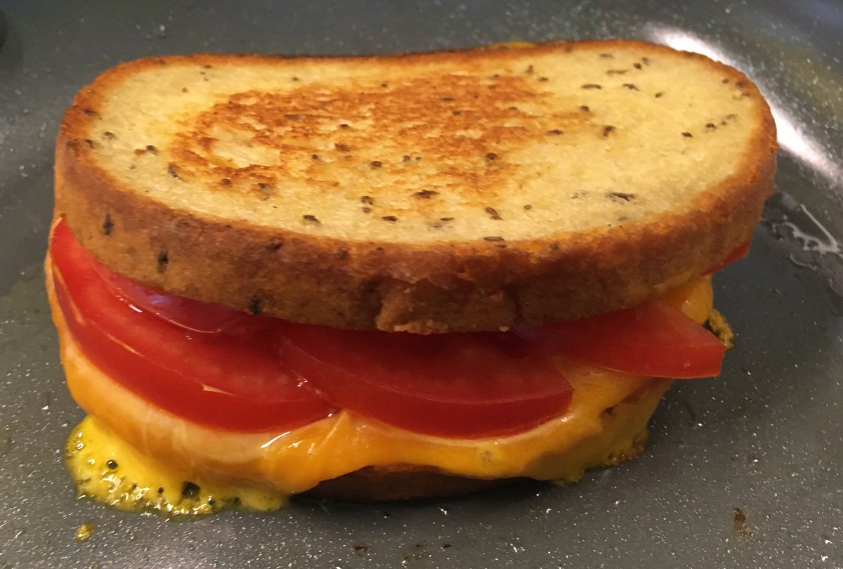 CheeseLoverG's tweet image. Quite often, the simplest foods are the tastiest: Mild cheddar from Fromagerie St-Albert, Ontario field tomatoes and nicely buttered Viking Sweet &amp;amp; Sour Rye with caraway seeds, grilled on a nonskid skillet until lightly brown.

#CDNcheese #grilledcheese