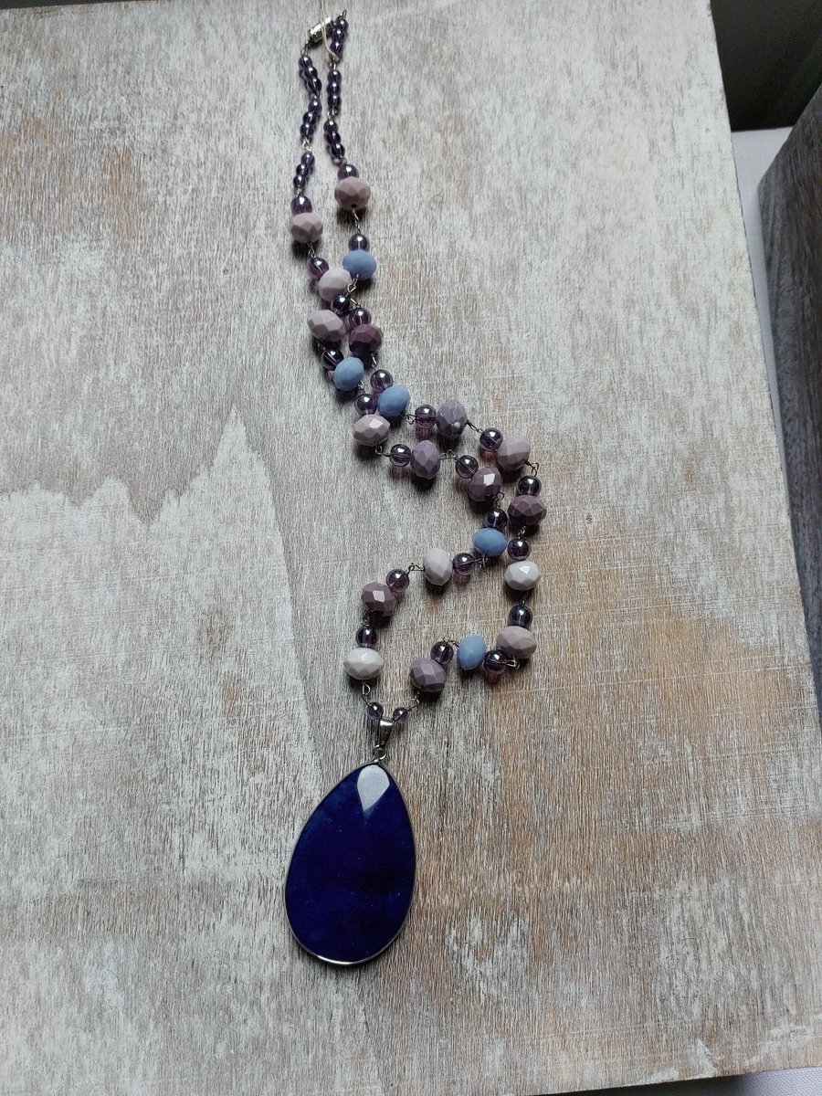 Excited to share the latest addition to my #etsy shop: Genuine blue stone pendant necklace | Grey glass round beaded | semi-precious pink, purple, blue faceted round beaded | hand wire wrapped etsy.me/3HeKGtL #midcentury #bluestonependant #semipreciousbeaded