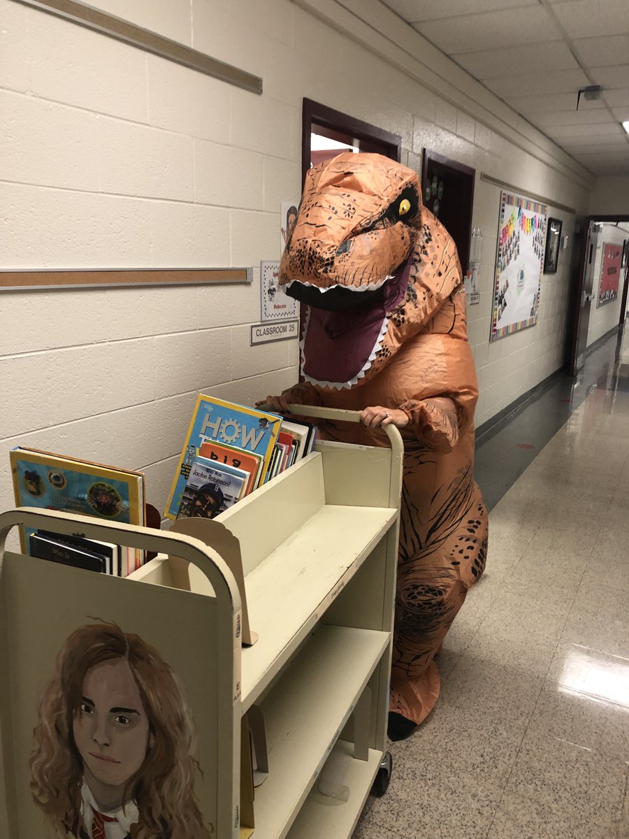 WhitehouseSus's tweet photo. How do you get your checked-out library books returned at the end of the school year? Make a fun video for the morning announcements and then collect books dressed as a T-rex. I love my job! @ALG_LCPS 
https://t.co/ia8ODUK6Bk https://t.co/2ByTUoBnWp