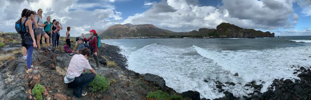 AmandaBClarke's tweet photo. A little lava flow lecture near Vulcanello, with La Fossa cone and caldera wall in the background. #SESE #ASUGEO #Lafossa #Vulcano https://t.co/zY555wu2rb