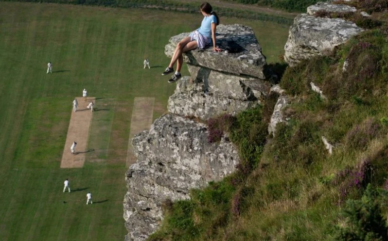 Second place in Wisden's Cricket Photograph of the Year in 2021 was this amazing picture by Jed Leicester of a spectator watching a match at Lynton and Lynmouth CC in Devon. The stunning ground is situated in the centre of The Valley of Rocks, between two giant tors