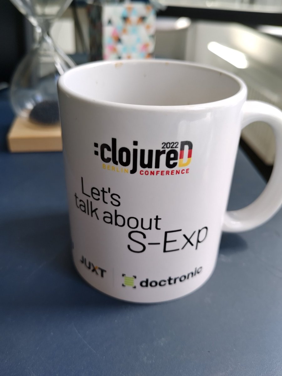 konradkuehne's tweet image. Using the new #clojureD mug in the office. It&apos;s a nice addition. 🙂