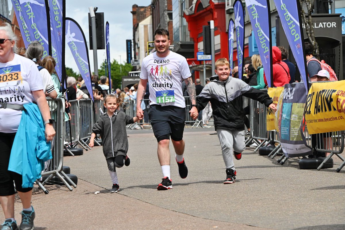 stokey1987's tweet photo. Crossing the finish line at the potters arf in 2:26:42 with my 2 favourite little people running for @UHNMCharity https://t.co/oJjHpNe5oZ