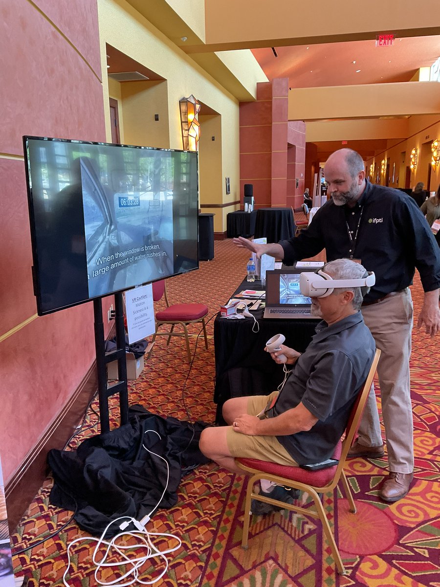 ifpti's tweet photo. IFPTI's Kirk Sundling is guiding Ron Klein through a virtual reality demonstration at #AFDOAEC. Conference attendees can try this out for themselves to see how it can prove useful in training by stopping by our exhibition booth or at the technology session from 3:30-5pm today. https://t.co/pfsR3betAP
