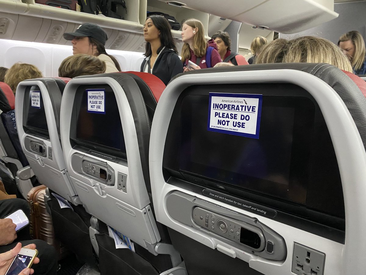 CAVIII's tweet photo. ⁦@Am_Airlines⁩ my family of 5 is traveling to Rome. 48 hours before, AA solicits is to upgrade our seats for $113 per seat and we did it. When we show up, this is what we get. All seats are without power. How do you justify this? May I have a refund please. https://t.co/N0oxh6M08X