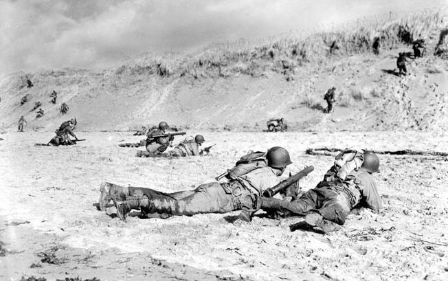 The crisis at Omaha was so bad that General Omar Bradley, watching from offshore through binoculars, considered calling it off and ordering an evacuation. However, officers on the beach took initiative and managed to rally infantry to punch up the cliffs and break out. (12)