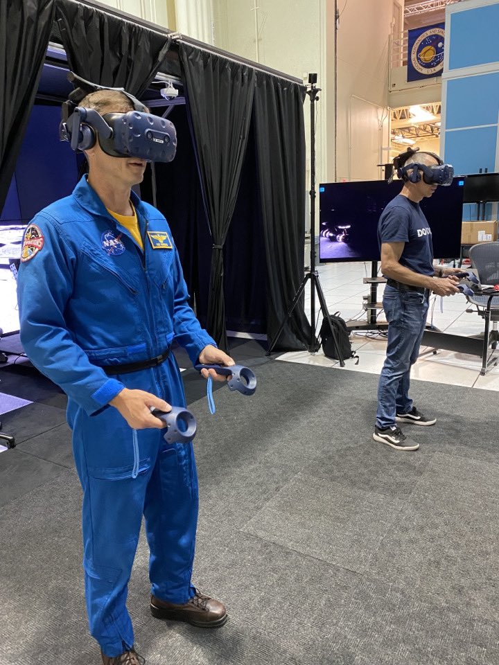 Astro_Feustel's tweet photo. Astronaut Chief (@astro_reid) and his deputy (me) explore the VR surface of the moon. @USNavy Pilot and a @theAGU Geophysicist working for the future of exploration. #Artemis https://t.co/HoosHdz5VG