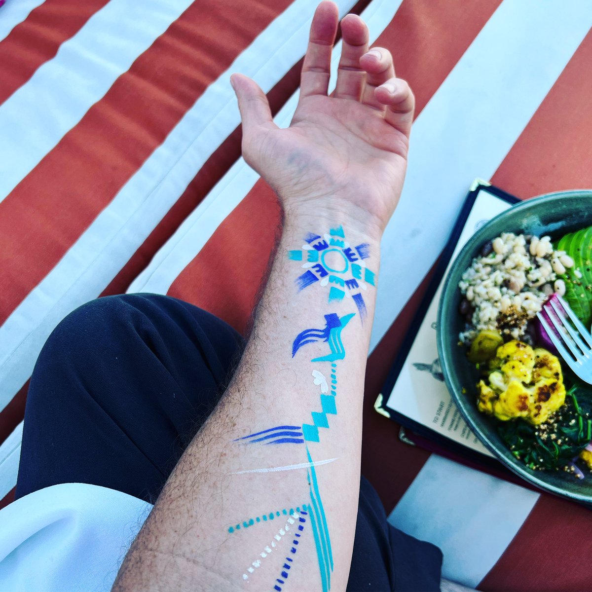 HeyBaylen's tweet photo. Met someone by the pool, she painted my arm while I ate a macrobiotic vegan bowl.  guess this is me now. #wheninLA https://t.co/BH9GnYoA3l