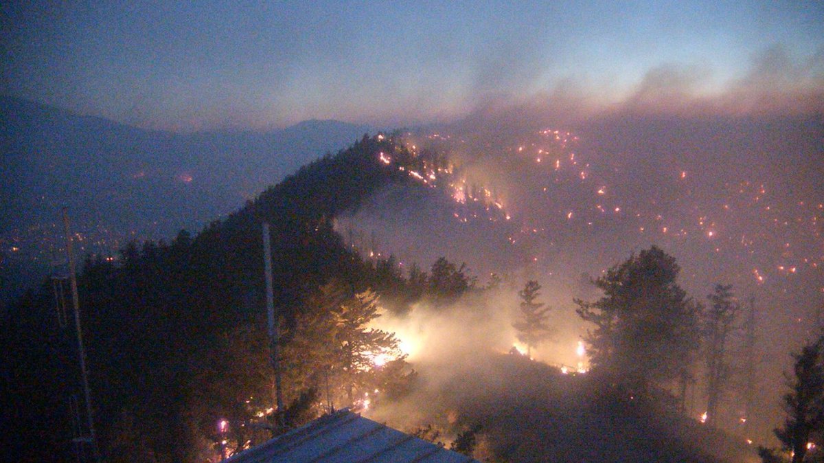 NWSFlagstaff's tweet photo. Views from the O'Leary Webcam at 360 Overwatch tonight at 8:28 p.m.  give us an idea of just how far this fire has spread... from the peak to the valley below. The views we're accustomed to will be black come morning. This is why we obey burn bans! #PipelineFire #azwx https://t.co/YRhcKbajpM
