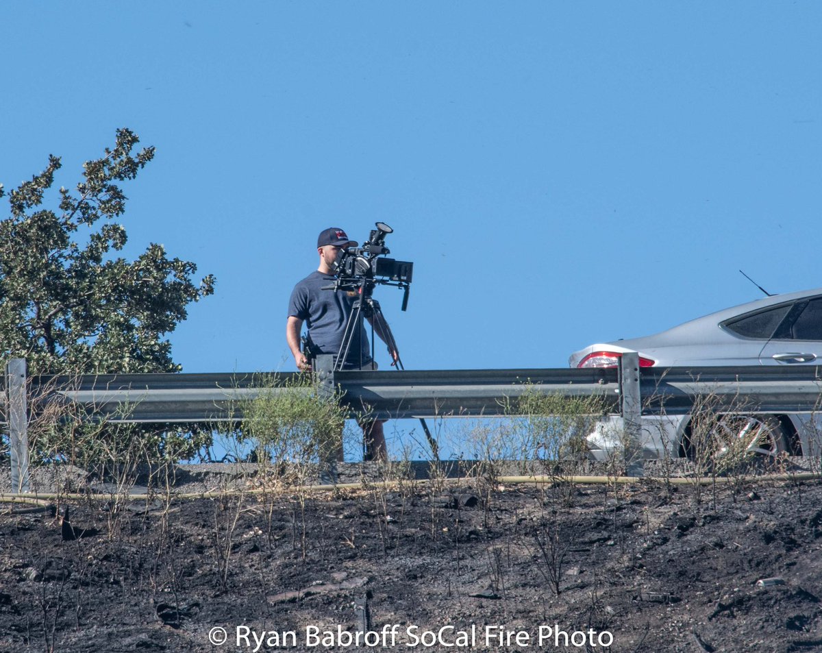 SoCalFirePhoto's tweet photo. Well here starts the annual calling out of “MEDIA” on wildfires.  Though a small fire today still had this “photographer” show up with an @LACOFD hat on and in SHORTS Another “photographer” wearing his best business casual PPE.  IF YOU ARE GOING TO BE AT AN INCIDENT WEAR YOUR PPE https://t.co/rWZauEpLyd