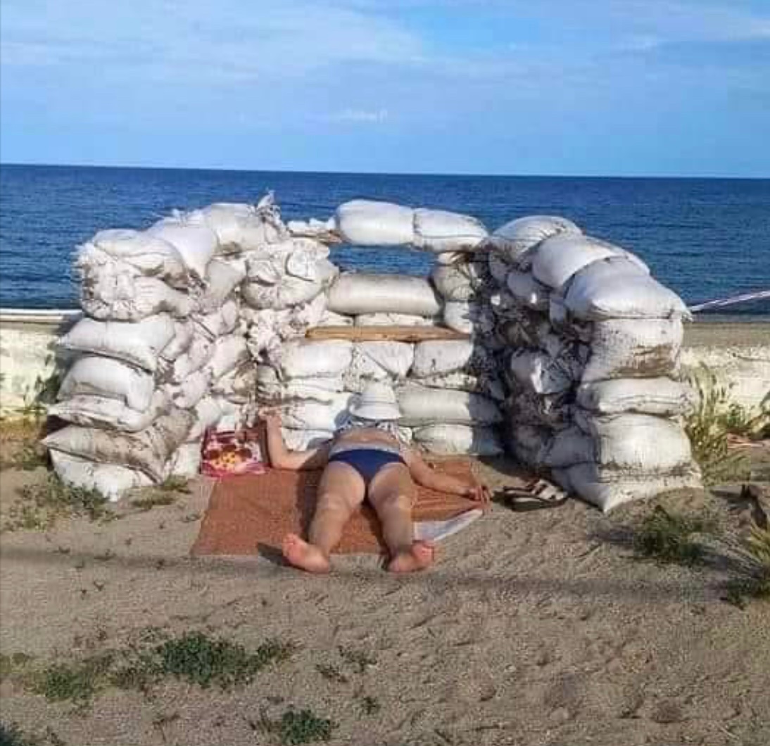 In Odesa, Ukraine, it is a vacation season. In Odesa, Ukraine, it is a war season.
So people do sunbathing at the barricades.

Thanks to Sergey Naumovich for the photo: