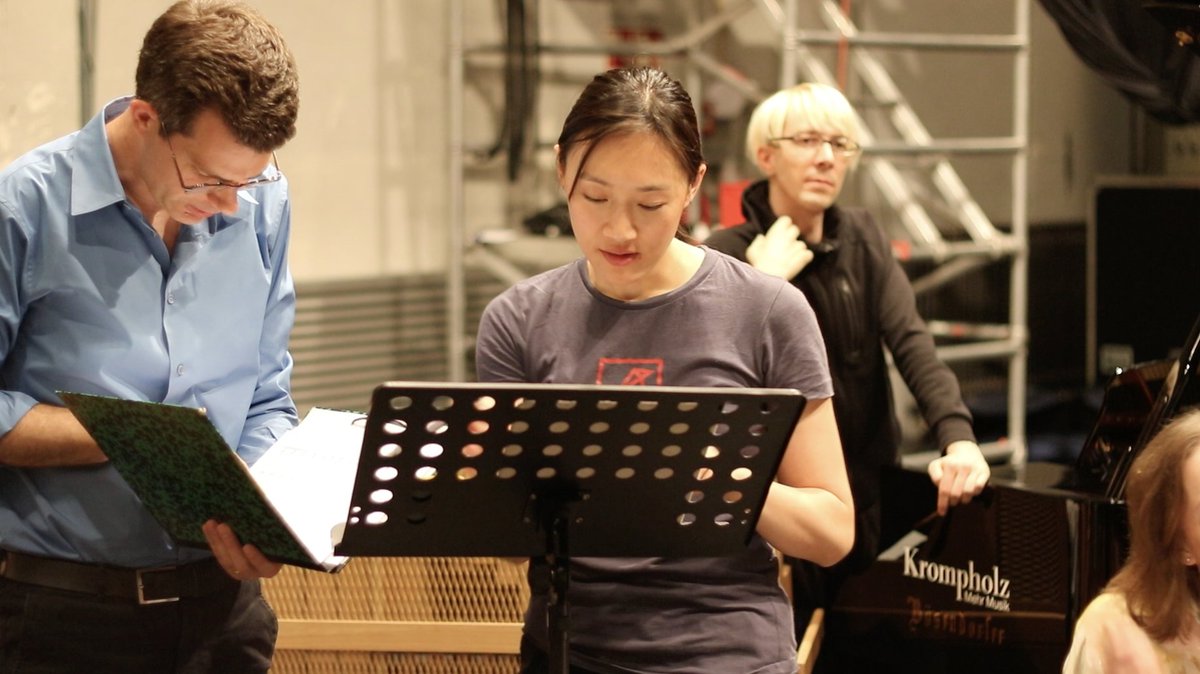 Soprano Peyee Chen negotiating the words of Jeremy Prynne yerterday at our rehearsal in Bern. World premiere tonight!!