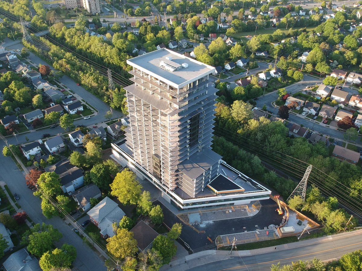 DexelHFX's tweet photo. We’ve got eyes in the skies! 
 
This is drone footage of West22 and the pretty green tree-lined west end streets of Halifax -  at 600 feet above the ground. 🌳 

#West22Living

#HalifaxConstruction #DexelDevelopments #HalifaxNS #Summer #ParamountManagement https://t.co/TwGmsblGFW