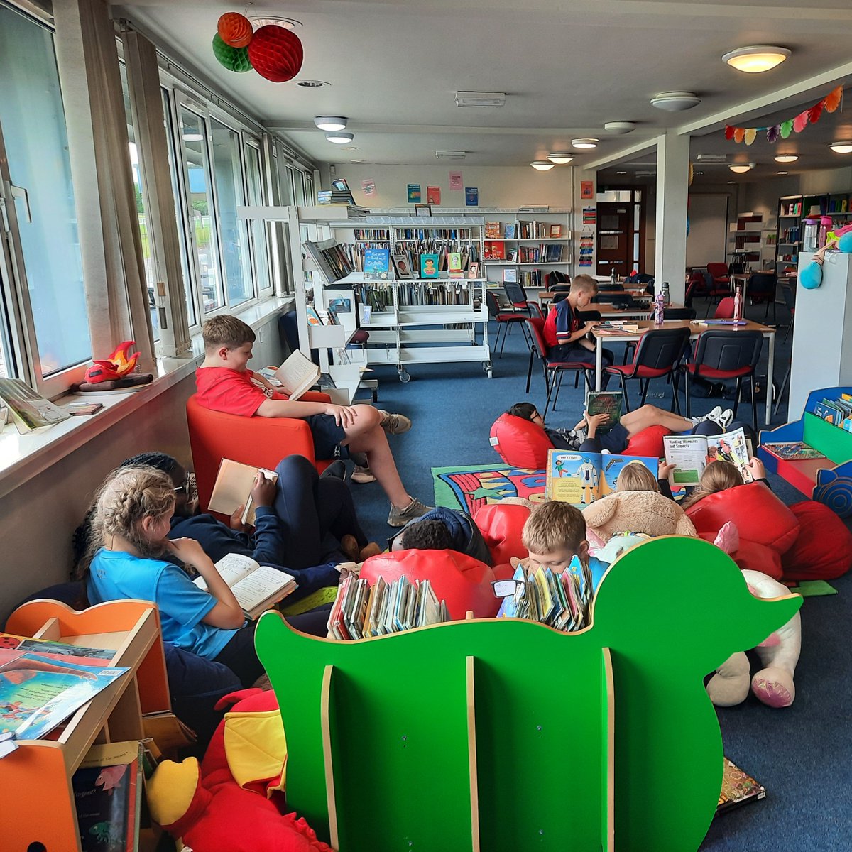 HCScot_Library's tweet photo. After a tiring but enjoyable afternoon in at Sports Day what better way for our #hamiltontransitus pupils to unwind that a reading period in the library. 
#hamiltonliteracy https://t.co/tJuQgZ4TQR
