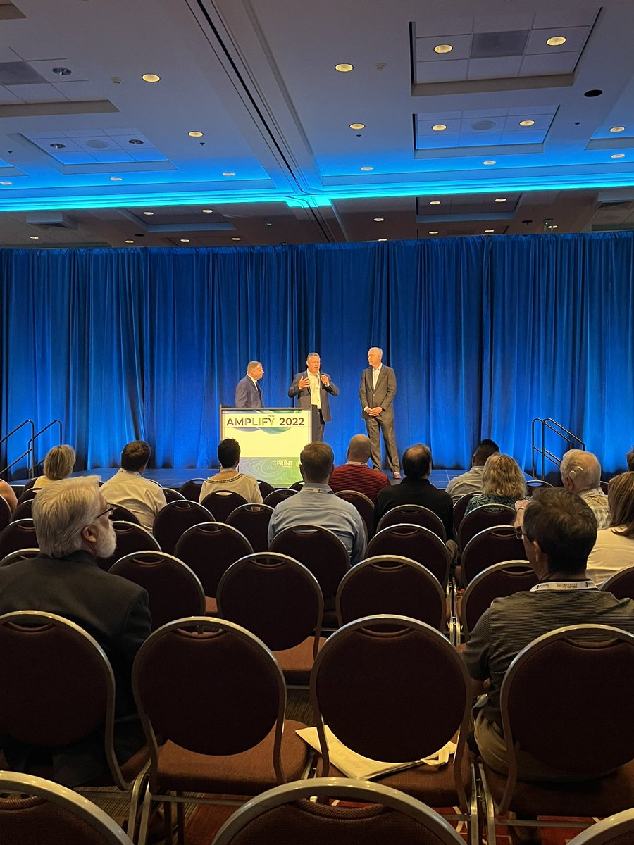 AmplifyMyPrint's tweet photo. Let’s #GetAmped at Amplify! We’re kicking off this weeks event meeting with some of our incredible attendees and staff. Welcome to the stage @ThayerLong from @APT_tech and Jeff Peterson from @foil_fx! https://t.co/PERrdLgzu4