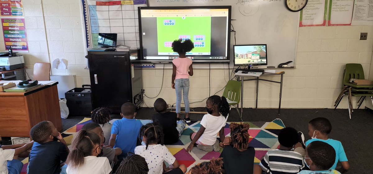 Mrs. Waller's Kindergarteners are working on an interactive math activity on the View Sonic board. They are matching numbers between 0 and 10 with the correct objects that are in the basket. 💚💛🐝 #xSEL #TopNotch