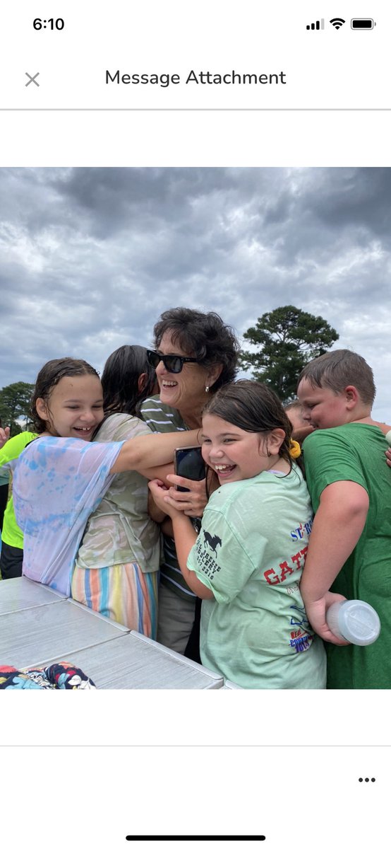 StoakleyMary's tweet photo. A very soggy group hug after a drenching on field day!@VBFairfieldES https://t.co/nbYfApEDYb