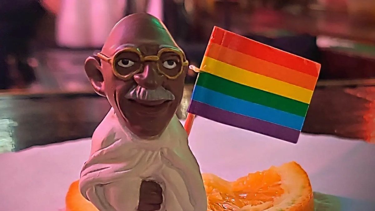 MiniMahatma's tweet photo. While my companion enjoys one of the world's best Hurricanes, I am celebrating love. #LoveisEverywhere #NewOrleans #Nawlins #Local718Bar #hurricane #Pride #minigandhi https://t.co/enxtNTeYKP