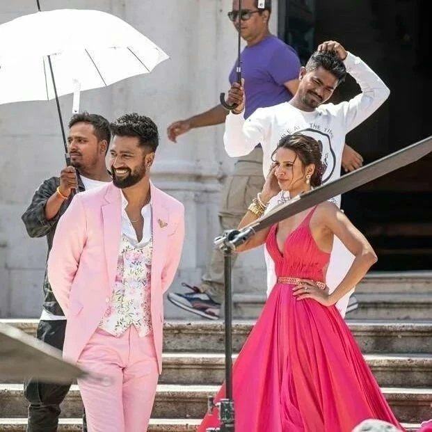 filmfare's tweet photo. Scorching BTS scenes from #VickyKaushal and #TriptiDimri's shoot in Croatia.  💕🔥 https://t.co/7pXMpviMRR