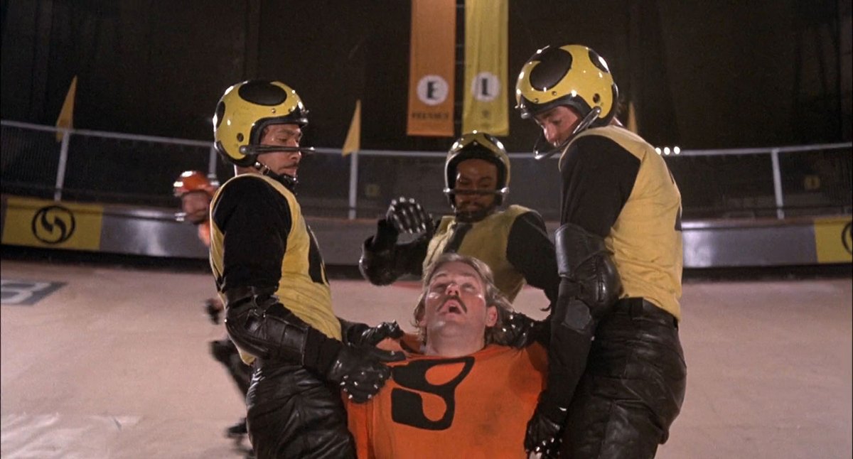 Rollerball (1975) takes place in a corporate dystopia where people live and often die over the ultimate combat sport. One superstar athlete struggles to make it to retirement with his dignity and neck intact.