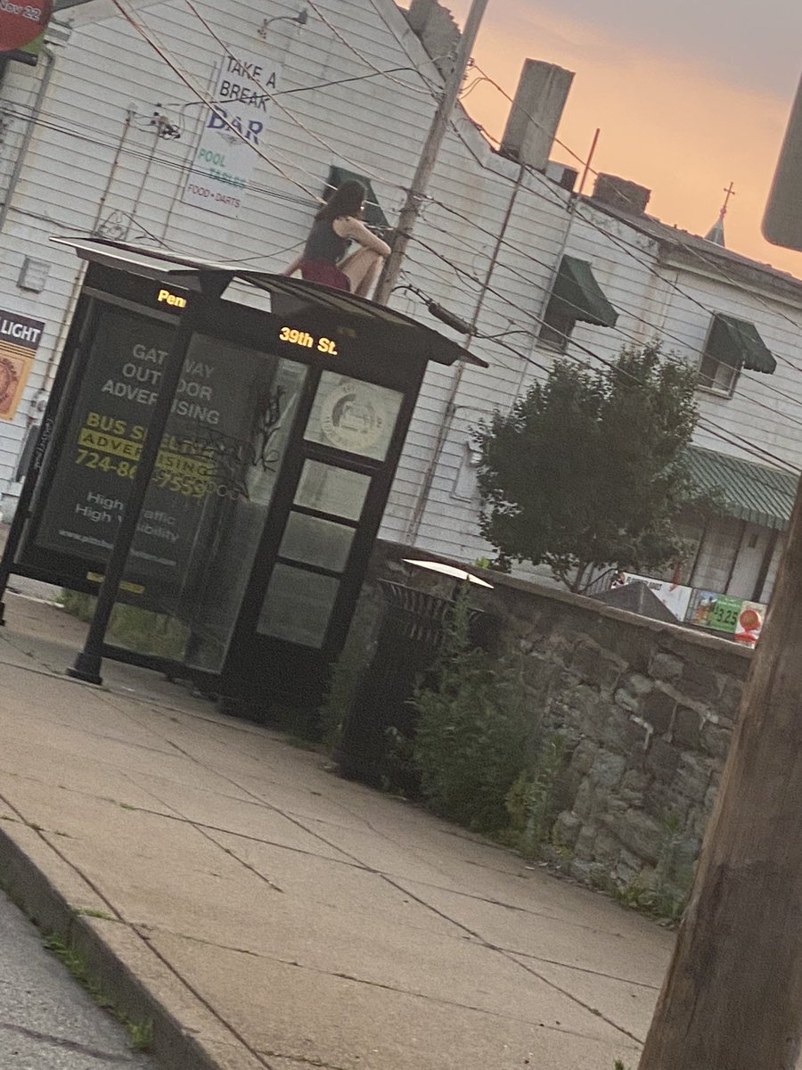 Still thinking about the woman I saw sitting on top of the bus stop as I walked into the bar last night