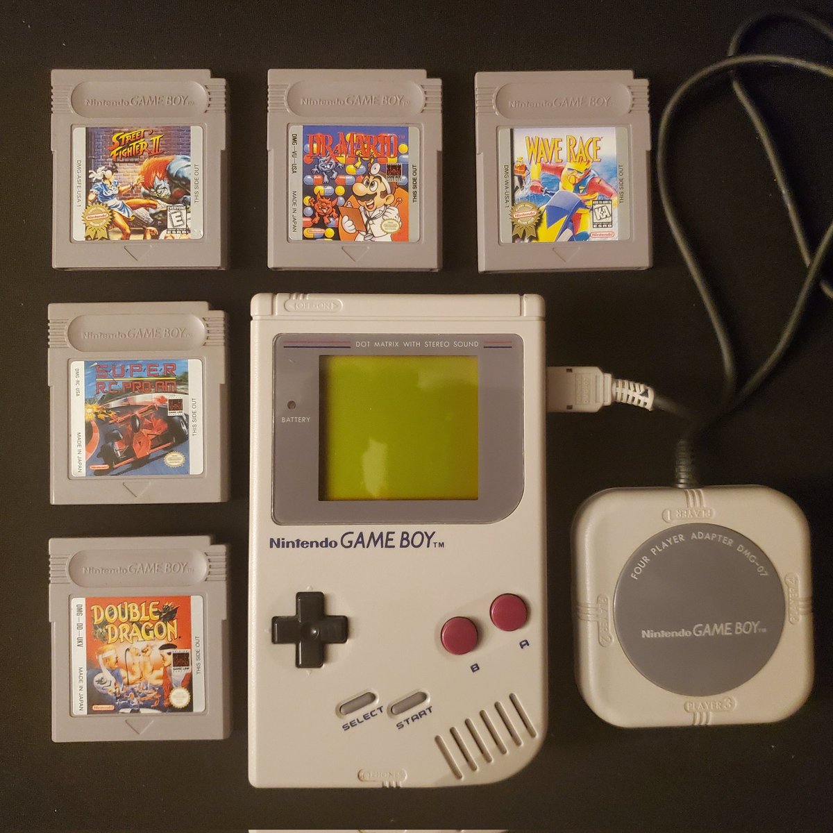 MouraBros's tweet photo. Day 15
While I never owned them as a kid, the link cable and 4 player adapter were such a great way to bring the multiplayer experience to handhelds. 
#summerofhandheldsgb #gameboy #greybrick #gameboypocket #linkcable #4playeradapter https://t.co/DR1Z43e0oT