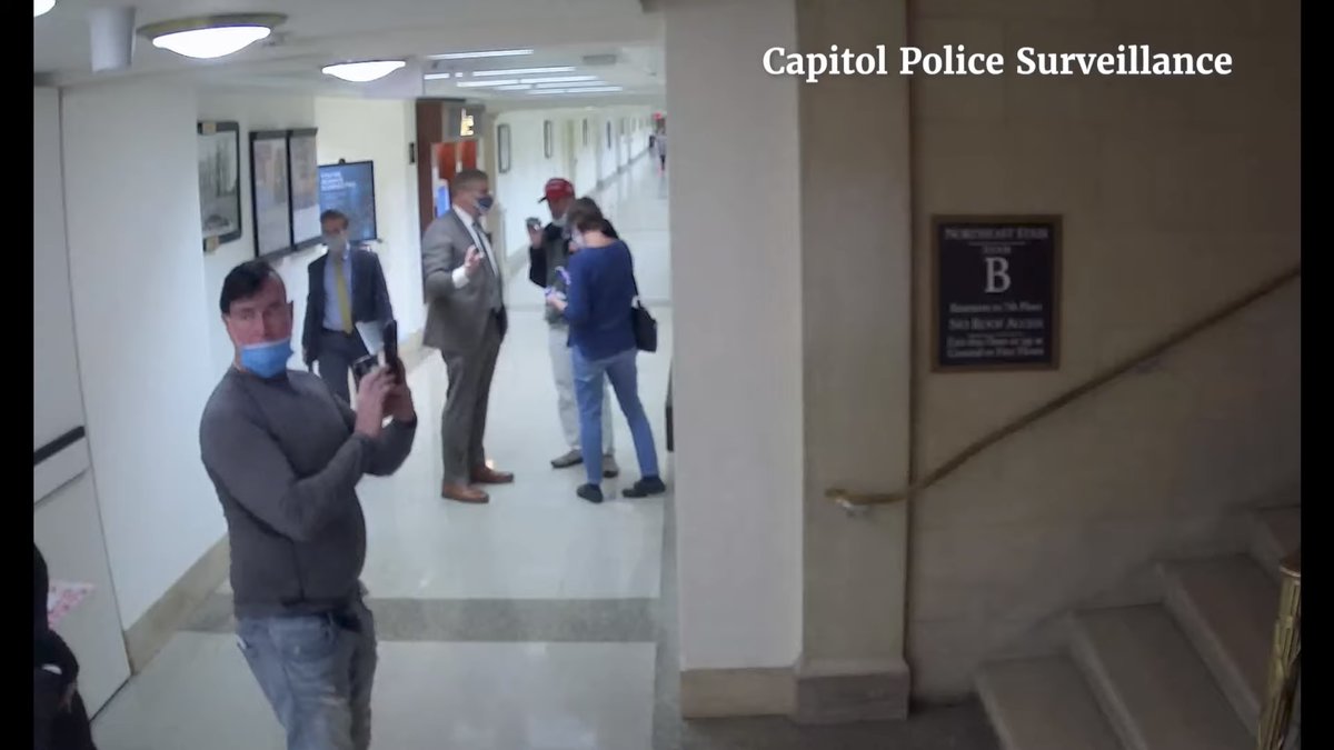 hugolowell's tweet photo. New: Jan. 6 committee releases clear evidence of Loudermilk’s tour group taking photos the day before the Capitol attack of staircases, security checkpoints and tunnels leading to the Capitol — here, Longworth staircase near hallway leading to tunnel https://t.co/9pjgdB6nXK