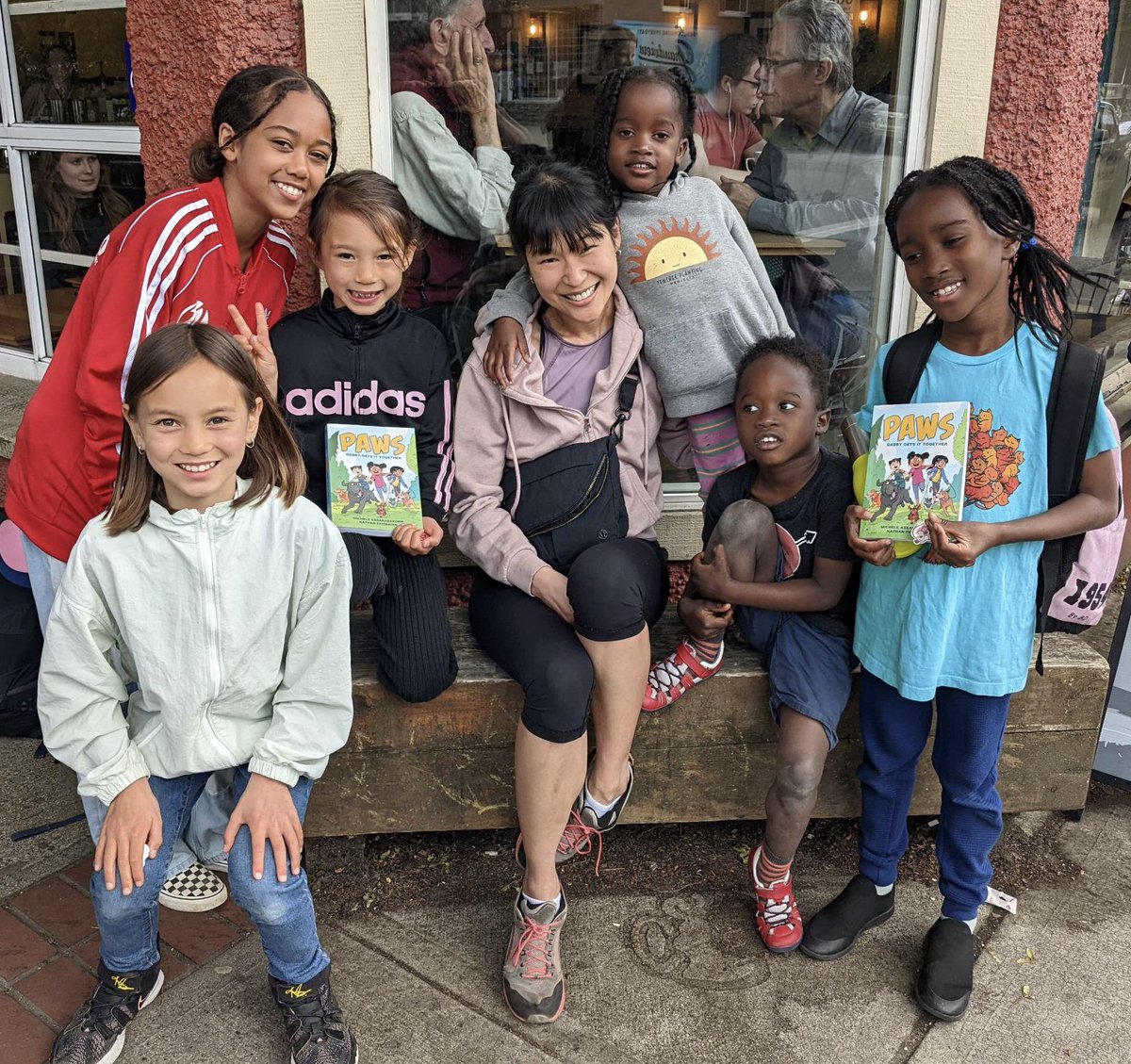 Oh, wow. Yesterday, @msassyk was contacted by a group of kids from our neighbourhood (where our new middle grade series, PAWS, is set) who wanted to meet her. Look at their beautiful faces! 😭 This photo means more to me than I can put into words. This is why I make comics. 😊❤️