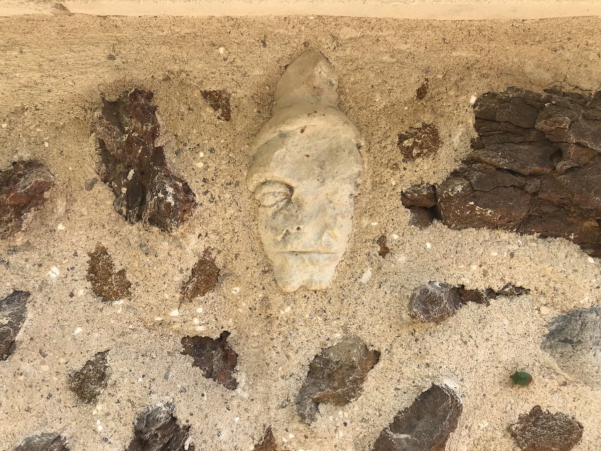For the past few months, we've been repairing St Mary's, Fordham in Norfolk. 
During some masonry work, the builders found some small pieces of carved stone in the south buttresses: including rosettes, snapped sections of tracery, and this small, badly weathered head.

1/4