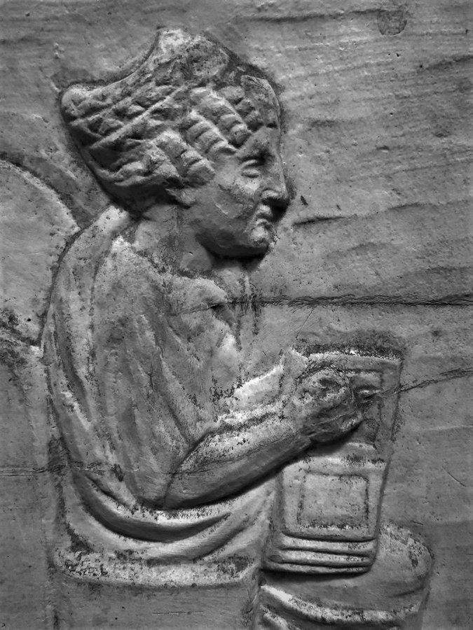 A famous #Roman funerary relief of a butcher at work, from Ostia - in the back room is a lady whose hair &amp; clothes identify her as wealthy &amp; interestingly the relief suggests she is working, doing the accounts for the business. The relief dates to the 2nd century AD.