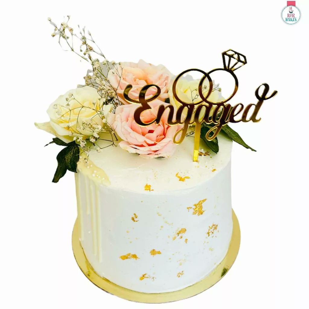 A simple floral engagement cake 💫
Cake flavour - Chocolate orange truffle 
Cake weight - 2kg 
#chocolateorangetruffle
#engagementcake
#floralcake #cake #sweet 
#simplecake #minimalistcakes #cakedecorator #Cakeartist #ediblelove #cakepreneur #homebaker #ahmedabadbaker #rnrbakes