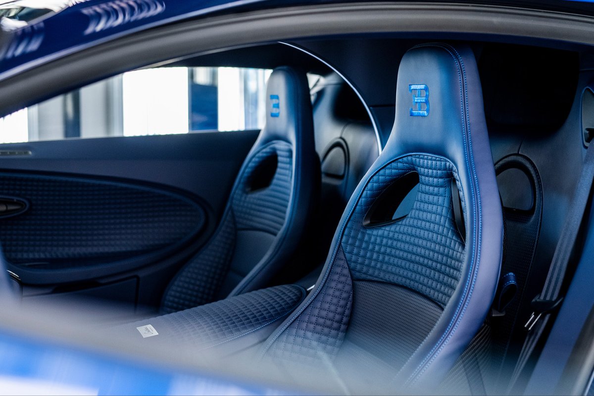 Bugatti's tweet photo. Inside the cabin of the first customer CENTODIECI unit is a sea of Deep Blue leather, with each seat precisely hand-stitched with expert craftsmanship.

#BUGATTI #CENTODIECI #EB110 
–
https://t.co/mCEE0gz924 https://t.co/rF05Zi2ieg