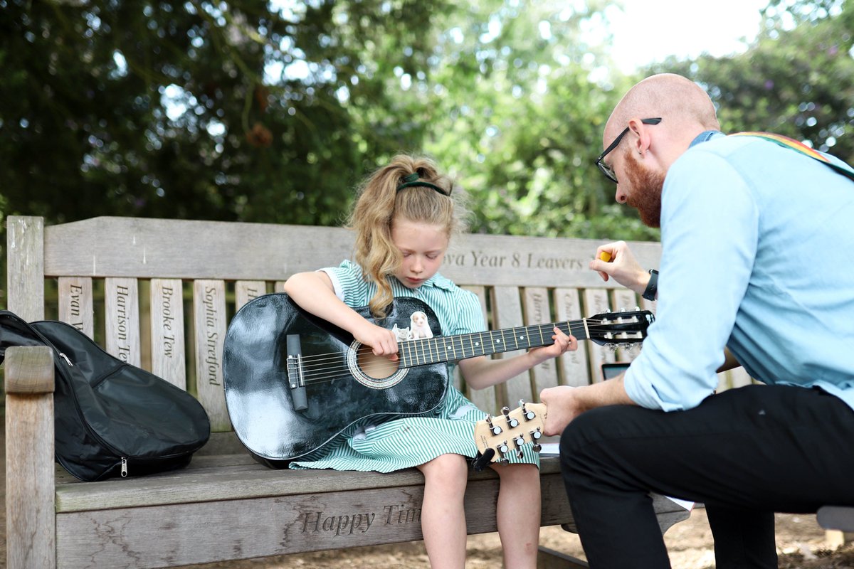 The weather is so beautiful today that one of our visiting music teachers, Mr Maddon brought his guitar lessons outdoors! A lovely change of scenery for our pupils to develop their guitar skills and just as pleasant for those walking past!