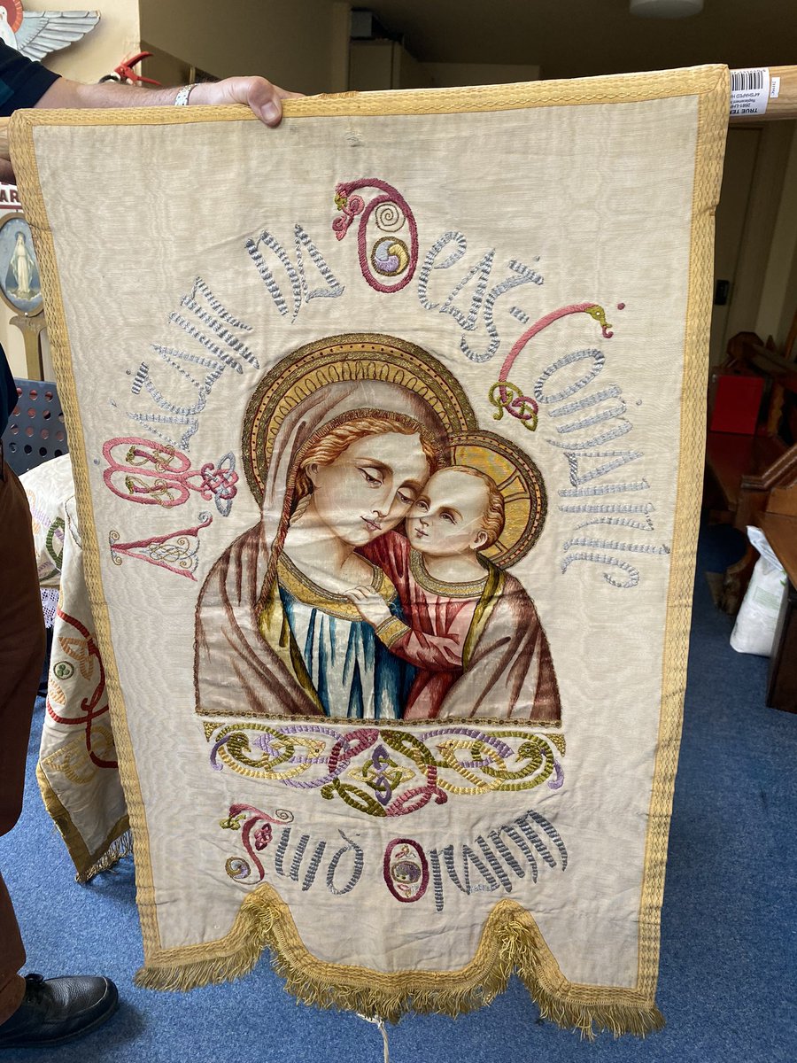 One of our old beautiful banners going in the Corpus Christi Procession tonight. The handmade embroidery on silk is absolutely stunning. The eyes are spectacular!