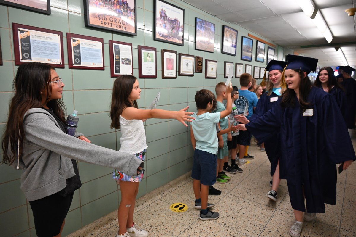 Members of the Class of 2022 had the opportunity to walk through the halls of their former elementary schools one last time on June 14. The soon-to-be-graduates were met with applause and signs of encouragement by the elementary students as they walked through the school.