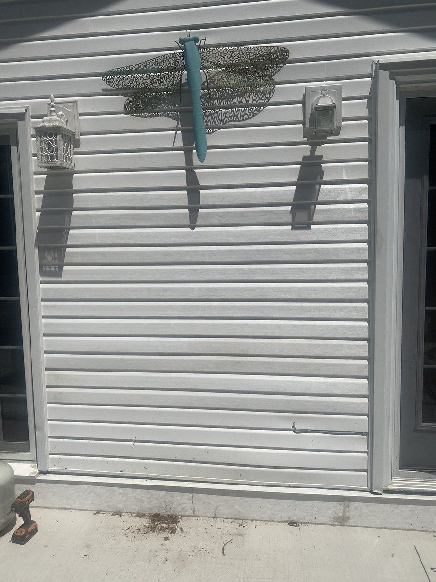 InsideOutRenos's tweet photo. This exterior feature wall had a not so nice feature!  Hot bbq and vinyl siding do not mix!!  Snuck this little repair in today as well.   #siding #repair #whosnext https://t.co/A6yjpJq5BX