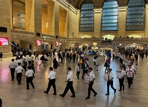 Delta_Pilots's tweet photo. @Delta_Pilots walk in solidarity today @GrandCentralNYC following picket at  @Delta Shareholders meeting. Delta pilots demand the airline match the # of flights with current pilot staffing to ensure safe, reliable service for our customers.#DeltaPilots #ALPA #ScheduleWithSafety https://t.co/4UpfOp9TIP