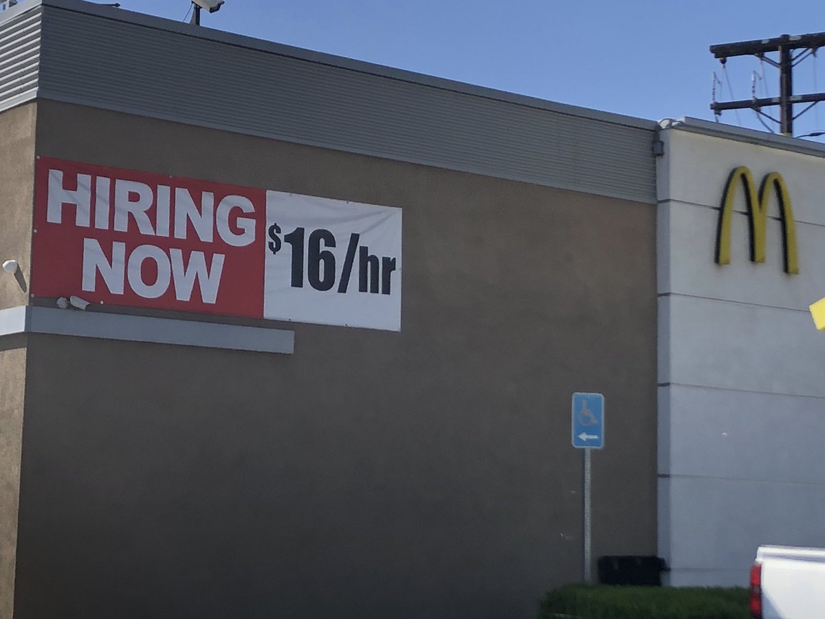 Jen_Iyer's tweet photo. I always see this sign on my way home from my third job and it’s killing me. McDonalds starting pay is only 83 cents/hour less than what I make after more than 21 years as a newspaper journalist. 🗞💰In case anyone was wondering why I’m leaving a job I love. https://t.co/hg22mwIer8