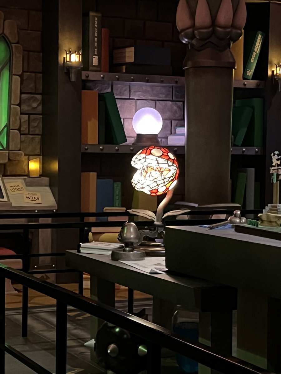 The queue takes you through various areas of Bowser’s castle. I loved the attention to detail, like how Koopa has books such as “The Art of Balloon Battle” and “Better Golf for Heavy Hitters” in his library. 

Also, I absolutely need a piranha plant stained glass lamp.