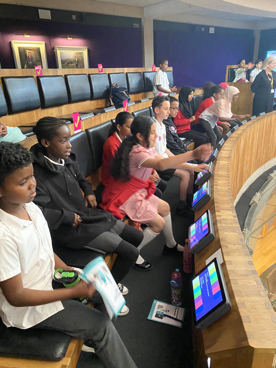 MSPSMissBogue's tweet photo. Year 5 visited the Senedd yesterday. We enjoyed exploring and learning about the building and then had a real life debate about anti-racism and if the children felt like enough was being done. I was very proud of their articulate arguments! @SeneddWales https://t.co/YtSCEecdsX