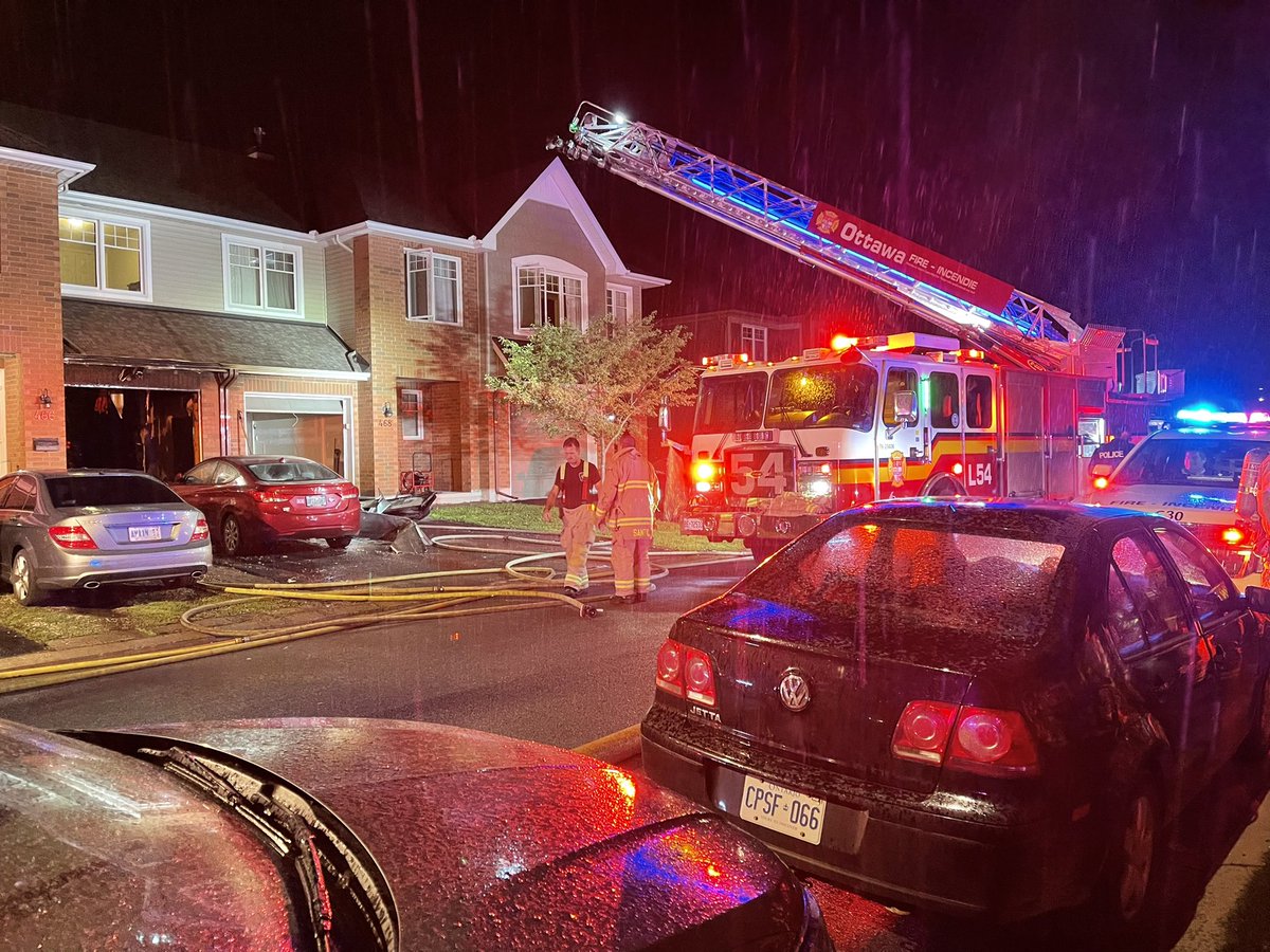 CapFireResponse's tweet photo. @OttFire crews are on scene of a garage fire on Stalwart Cres in Findlay Creek. Fire was contained to the garage of a two-storey middle unit row home. #ottnews #ottfire #onscene https://t.co/RzlIdWFQ4i