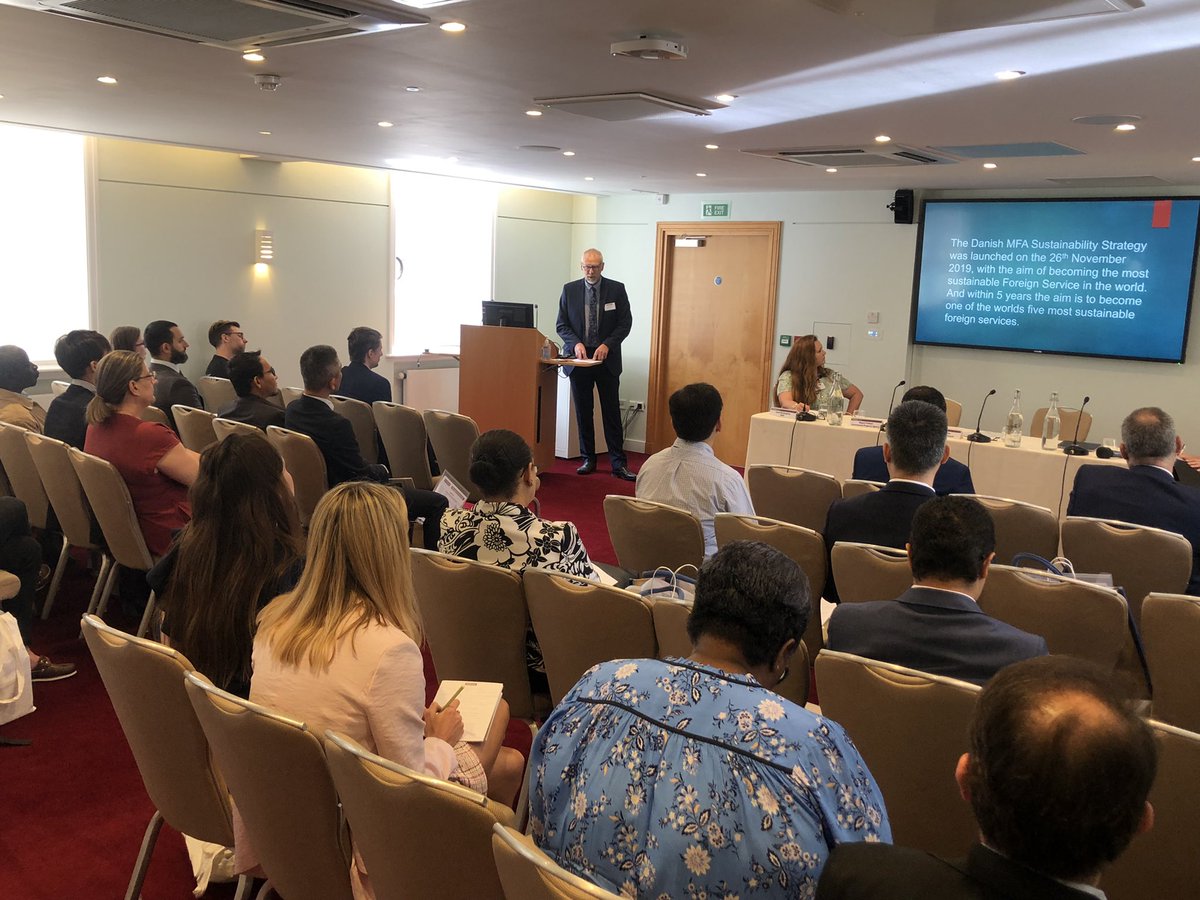 EmbassyMagazine's tweet photo. Phil Shilton @denmarkinuk tells colleagues about the benefits of Embassy of #Denmark’s Sustainability Action Plan to the environment and the budget. Imagine how much emissions the London diplomatic community could cut if they did the same? #GreenEmbassies https://t.co/ne7oFnnRIN